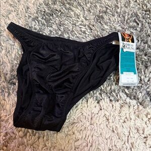 Andreas Cahling black posing trunks